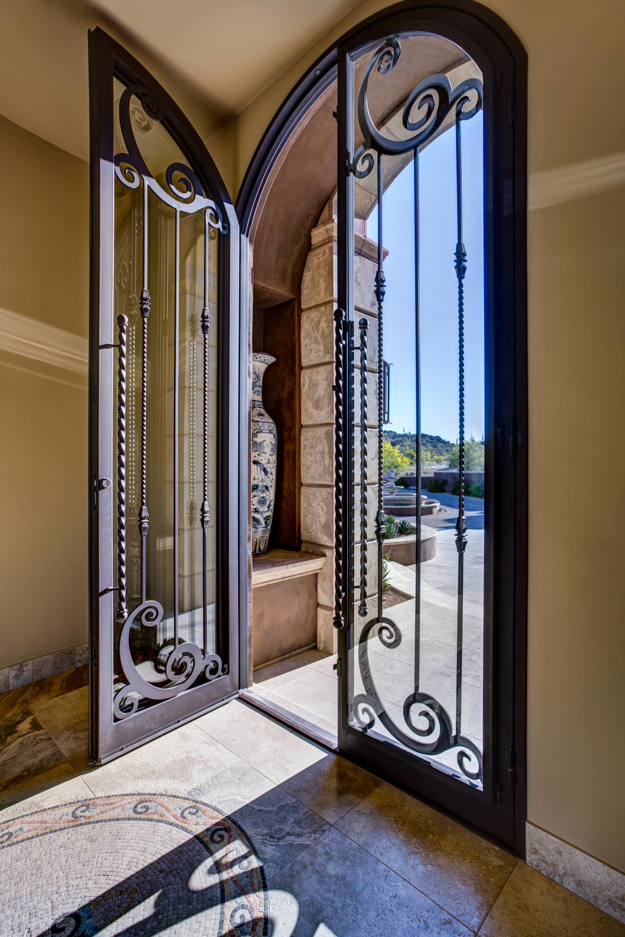 1920 #1E58AD Home Entryway With Tall Glass And Wrought Iron Door A Double Door save image Iron And Glass Entry Doors 40971280