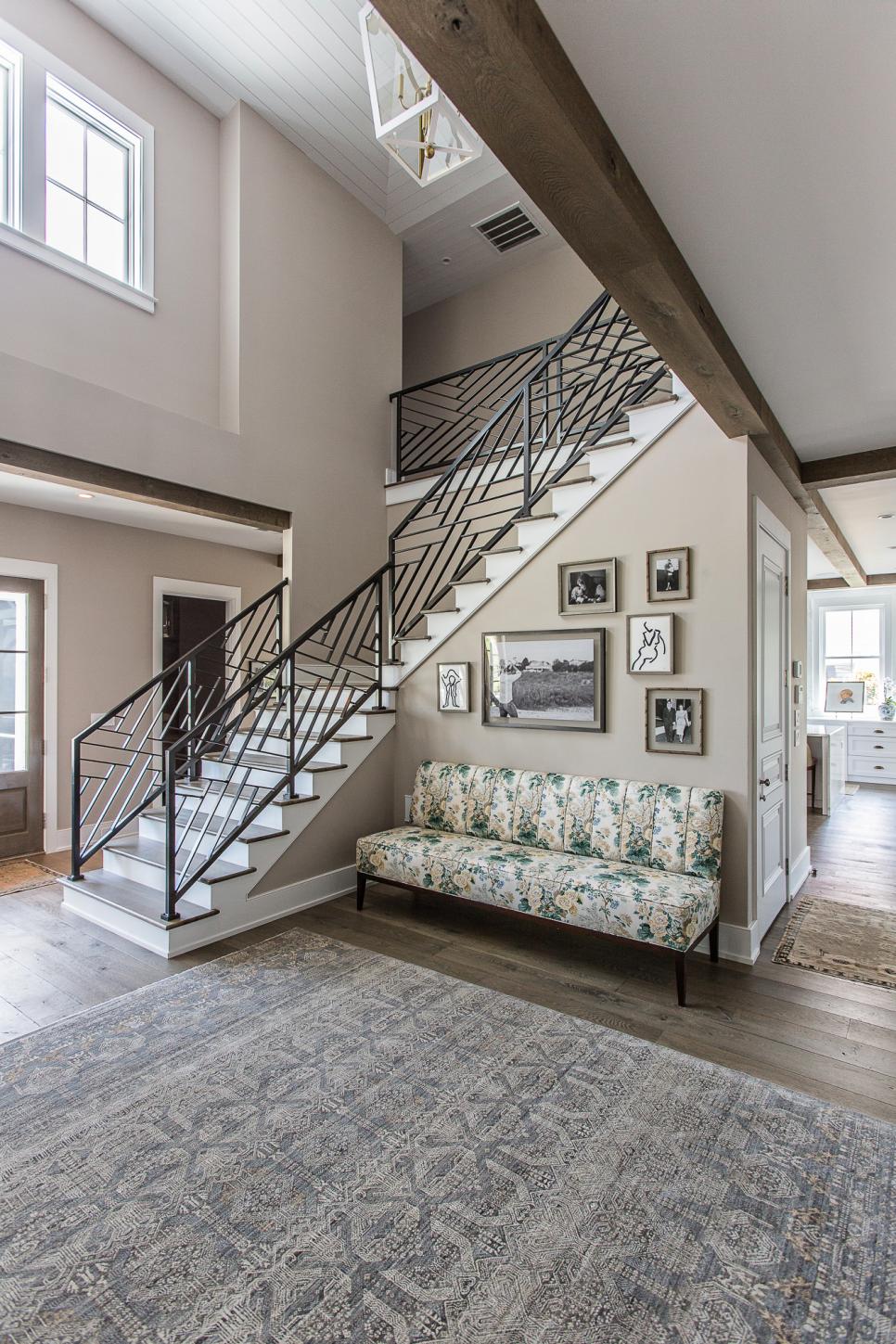 Chic Foyer Features Small Gallery Wall & Floral Settee Neutral, Transitional Entryway With Large Area Rug, Floral Loveseat