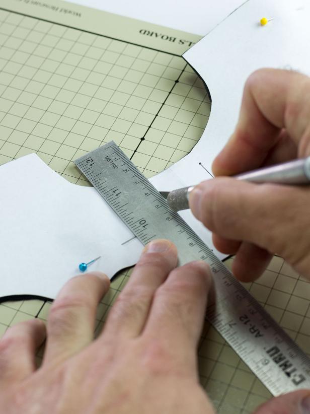 On one set of wings, use the lines near the center of the template to cut two 2" lines with a craft knife and ruler.