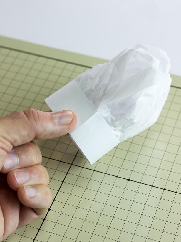 Bring the card stock around to form a circle and secure it with another piece of tape.