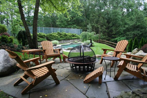 Patio with Wooden Furniture Arrangement and Portable Fire Pit Patio with Wooden Furniture Arrangement and Portable Fire Pit