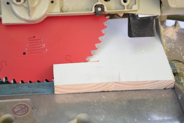 Using a chop saw, cut both ends of each front facing plank on a 45 degree angle. This is will ensure that the corners will have a clean, custom look. Each side plank will be cut on a 45 degree angle but only on one side. The straight cut will butt up to the existing wall at a 90 degree angle.