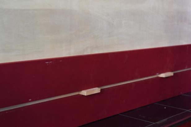 Once the planks are dry to the touch, begin installing them horizontally. Start with the front facing planks and work from the bottom up. Use a couple of plank scraps as spacers so you can work quickly with accurate spacing