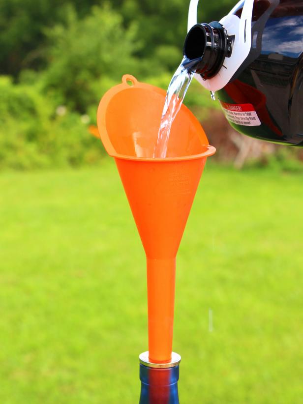 DIY Glass Bottle Citronella Torch Step 3: Add Fuel DIY Glass Bottle Citronella Torch Step 3: Add Fuel