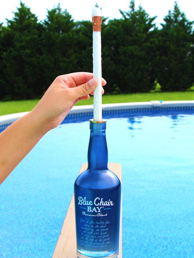 Slowly twist wick down into bottle.