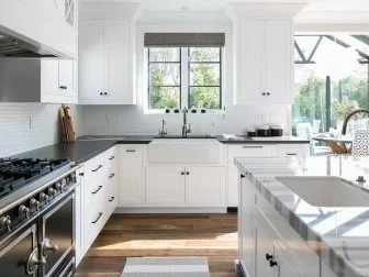 Transitional Kitchen With White Cabinets & Black Perimeter Countertops