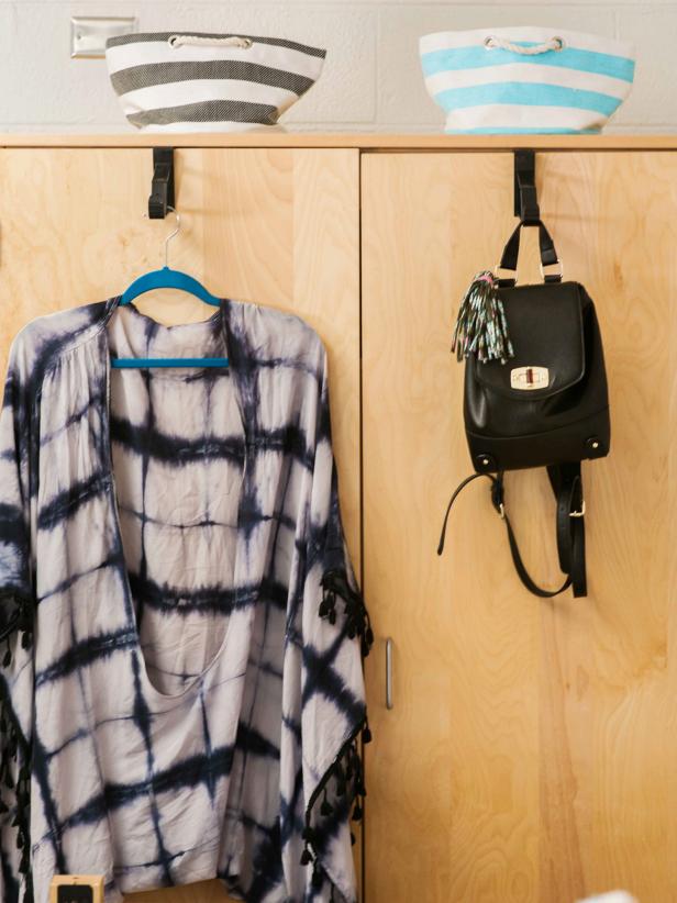 Dorm Room Wardrobe Decor With Over-The-Door Hooks Displaying a Poncho and Handbag Dorm Room Wardrobe Decor With Over-The-Door Hooks Displaying a Poncho and Handbag