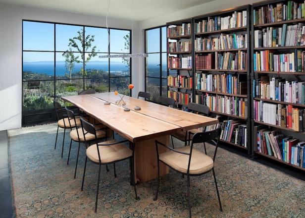 Dining Room With Large Windows, Row of Bookshelves & Wood Table Dining Room With Large Windows, Row of Bookshelves & Wood Table
