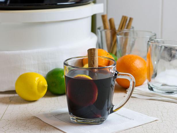 Glass of Slow Cooker Sangria With Cinnamon-Stick Garnish