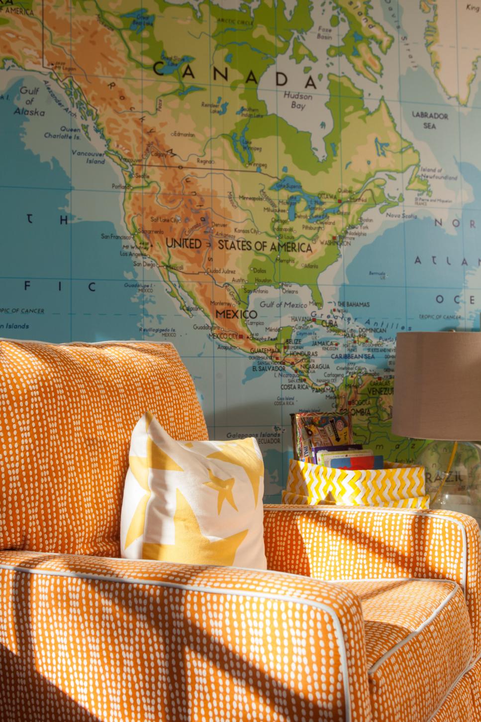 Stylish Orange Armchair Wall Covered With World Map Behind Orange Patterned Armchair