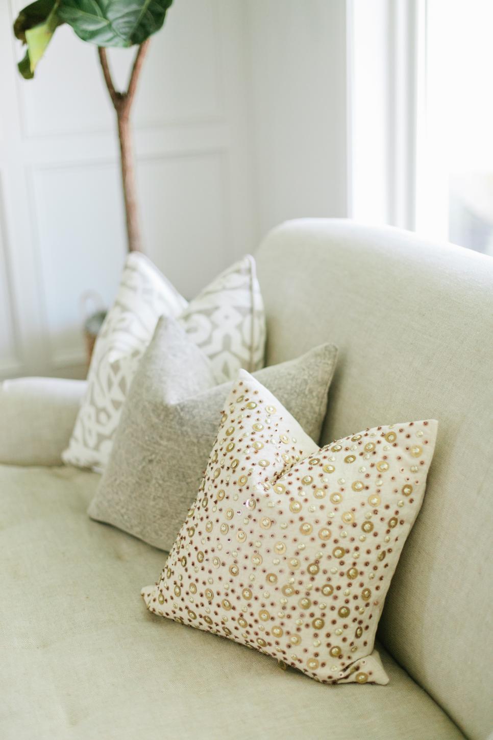 Detail of Throw Pillows Neutral Patterned Pillows on Neutral Sofa
