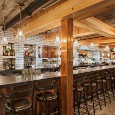 Contemporary Restaurant Dining Room with Long Bar, Wood Beams and Subway Tiles