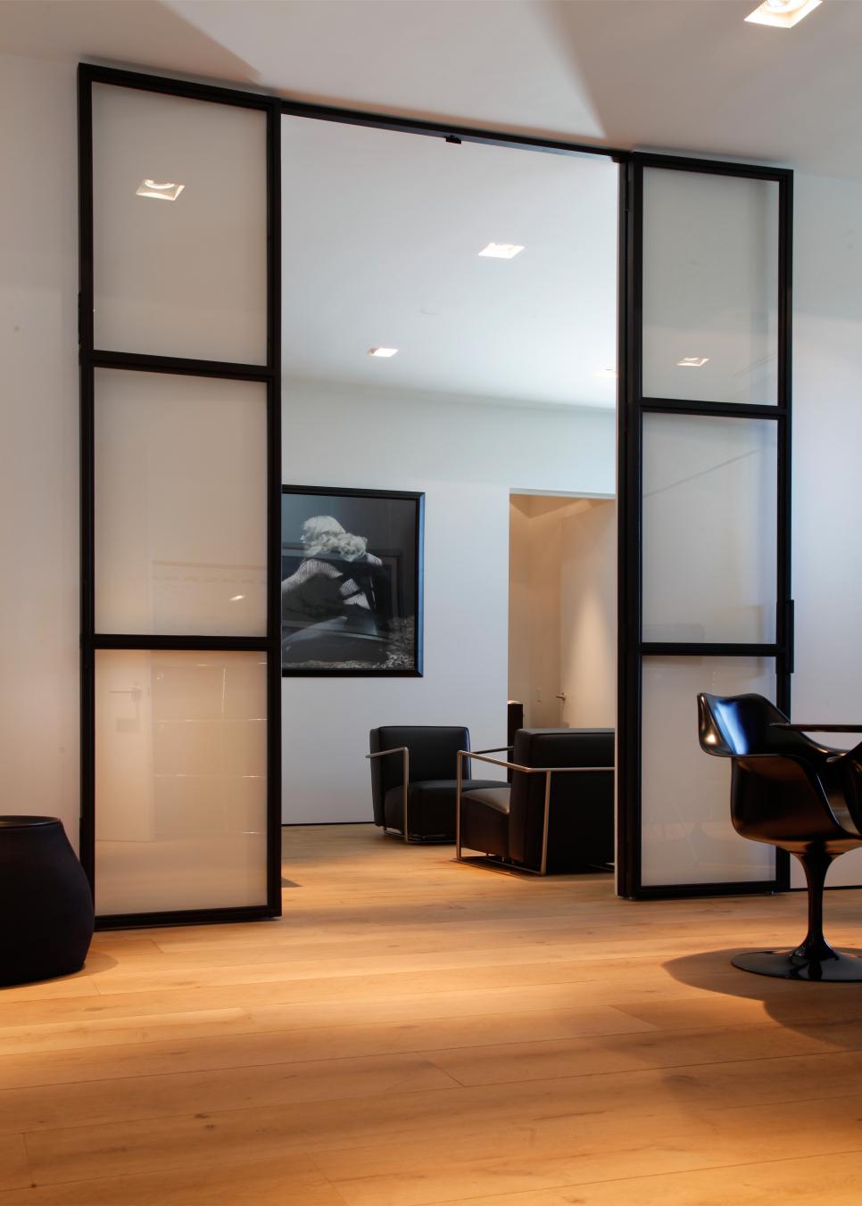 Modern Living Space is Clean, Minimalist White, Modern Living Room with Black Chairs