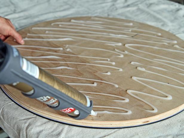 Apply silicone to the top side of the plywood.