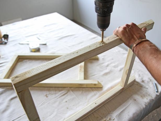 Drill a hole in each leg on the mark using a 1/4" drill bit.