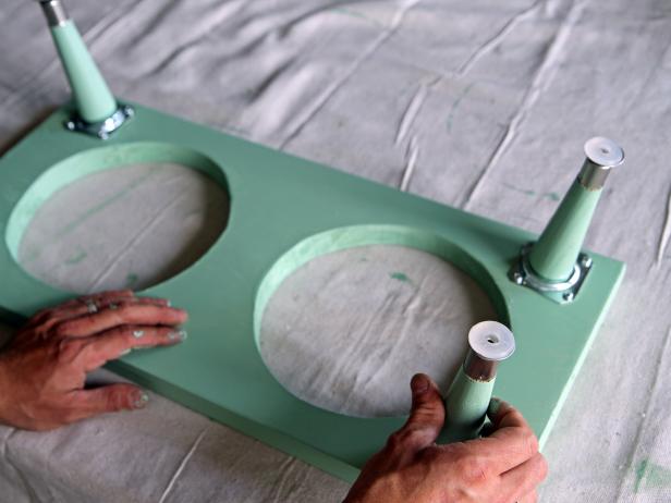 Attach tapered legs to angled top plates.