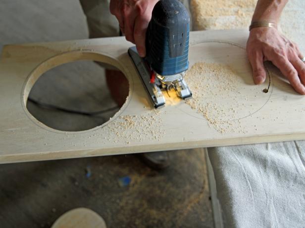 Cut out each drawn circle by placing the jigsaw blade into the drilled hole and cutting approximately 1/4” inside of drawn pencil mark.