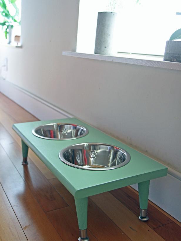 Make a pet feeding station using a wooden stair tread.