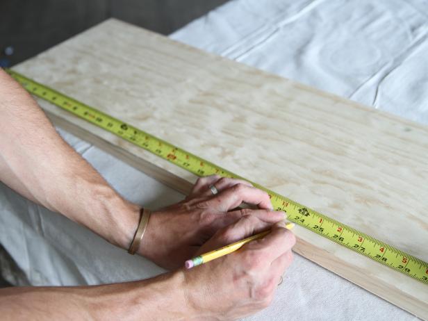 Measure and mark the wood stair tread at 24” with a pencil.