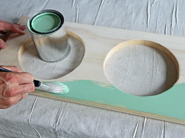 Paint the wood stair tread and the tapered wood legs with semi-gloss paint.