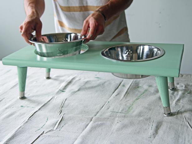 Place bowls in cut-outs of the finished pet feeding station.