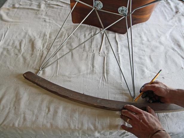 Lay the rocker and the chair sideways on a flat surface, and using a pencil mark where the legs line up on the rocker.