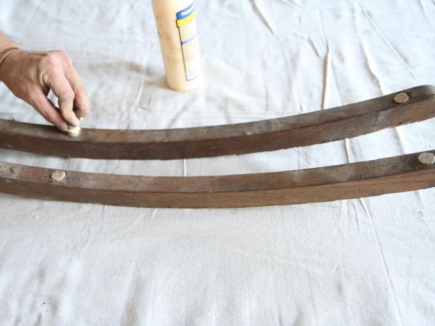 Apply wood glue, and insert dowels to fill previous holes in reclaimed rockers.