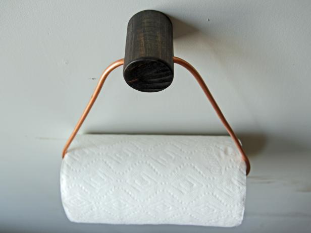 Add a stylish touch to your kitchen with a DIY copper paper towel holder.