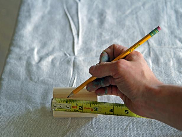 Measure 1” from one end of the cut dowel, and mark with a pencil.