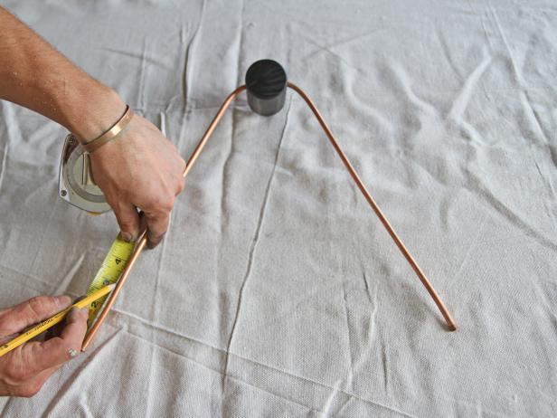 Measure and mark 3” from each end of the copper pipe with a pencil.