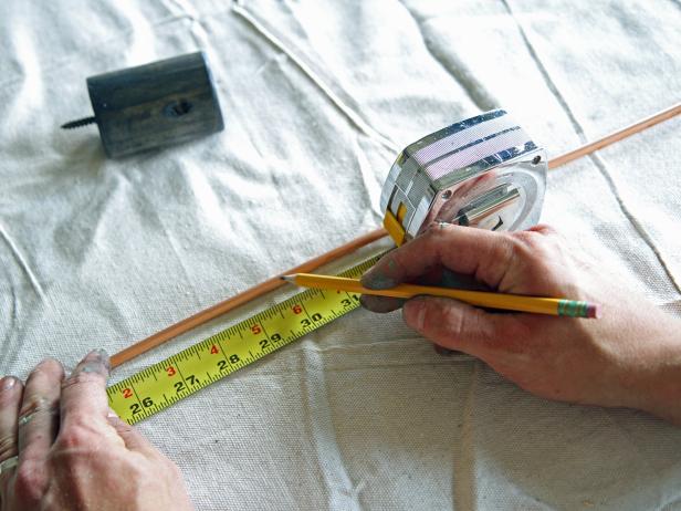 Uncoil the 1/4” soft copper refrigeration pipe, and make a mark with a pencil at 30 inches.