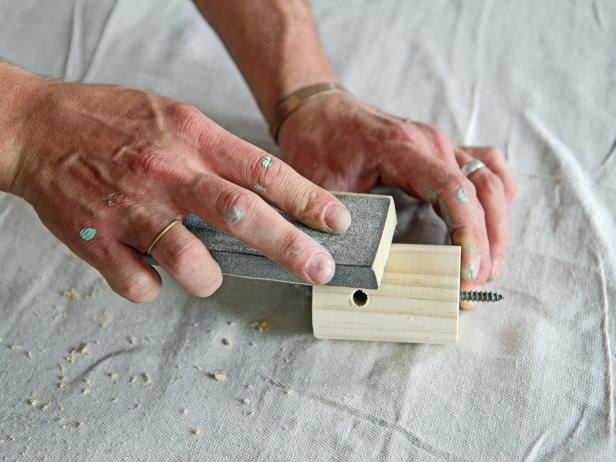 Lightly sand all edges of the dowel with a 220-grit sanding block.