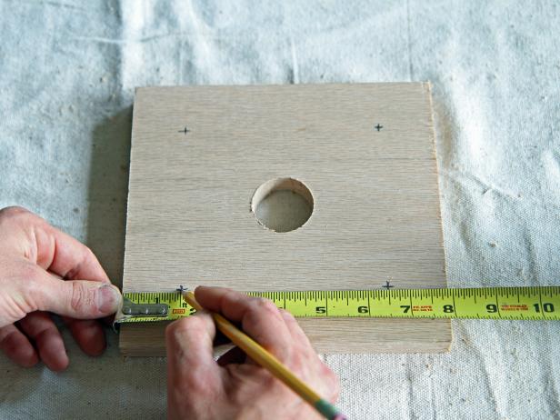 Measure and mark 1 1/2” from each corner on each side, making a plus sign in all four corners