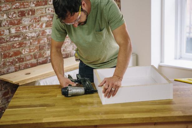 Assemble the melamine table form using a nail gun.