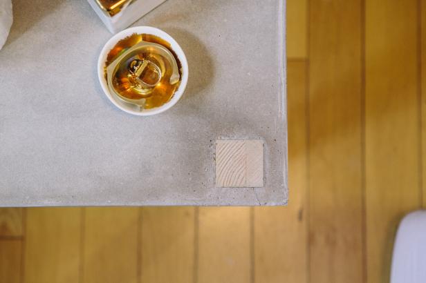 Make a minimalist end table with concrete and wood.