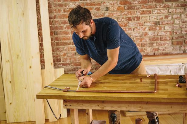 Apply epoxy to pipe joints to make an industrial-style sconce.
