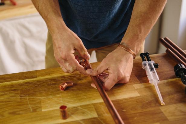 Attach pieces to end of piping.