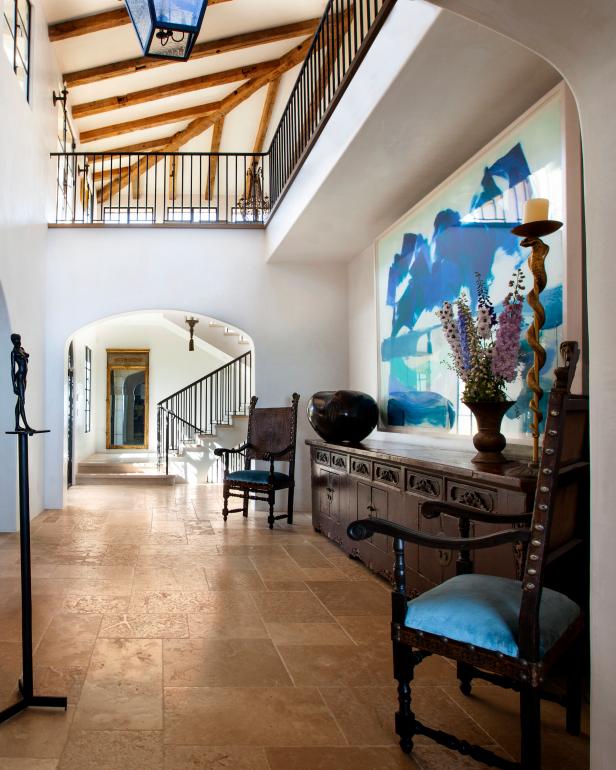 Hallway with Ceilings Open to the Second Level, Exposed Wood Beams and Large Modern Art Painting Hallway with Ceilings Open to the Second Level, Exposed Wood Beams and Large Modern Art Painting