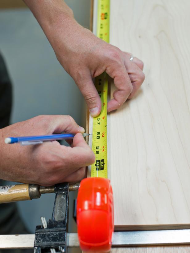 On a flat work surface, lay both sidepieces of cabinet side-by-side and clamp together. Starting from the top measure and mark desired placement of shelves. Mark top and bottom edge of shelf (which is ¾” thick.) Keep in mind the face frame and how shelves will be visible though glass doors. Make corresponding marks on other sidepiece. Use a straight edge to connect marks, clearly showing where shelves and supports will be installed.