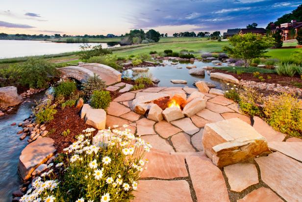 A Circular Stone Fire Pit With a Lake View A Circular Stone Fire Pit With a Lake View