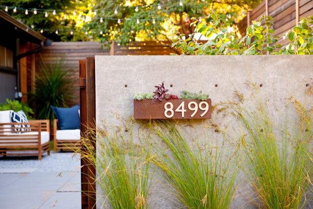 Modern Seattle Courtyard with Metal Planter and Concrete Wall