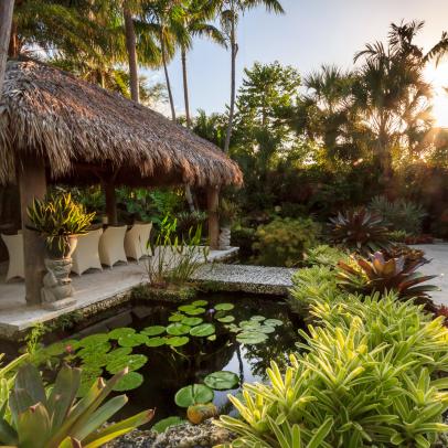 Tropical Landscape Design with a Water Feature, Bridge and Hut