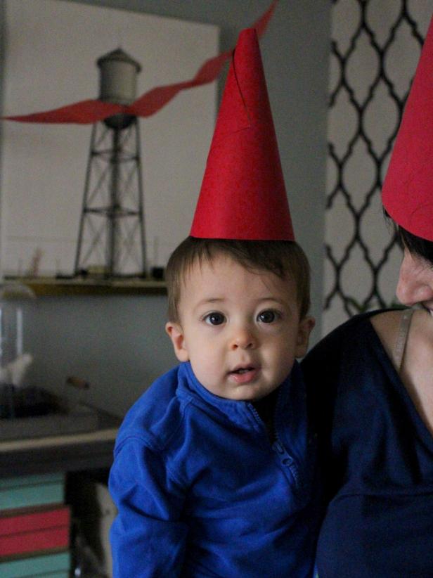 Baby Wearing Red Gnome Hat Baby Wearing Red Gnome Hat