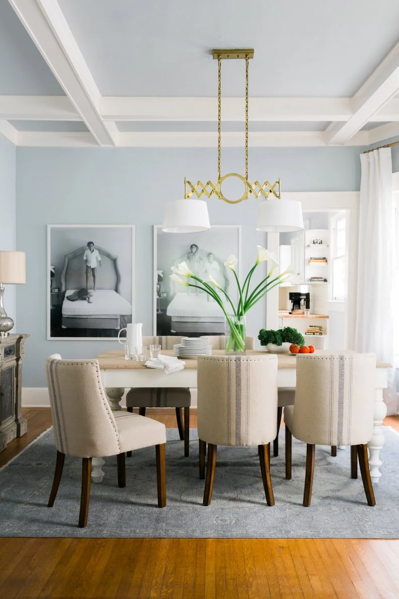 Neutral Chairs Lined Up in Front of Dining Room Table