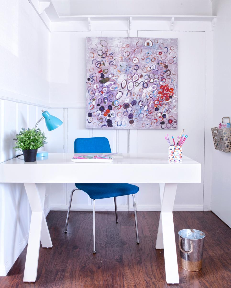 Bright White Home Office With Modern Painting and Bold Blue Chair White Home Office With Multicolored Painting and Blue Chair