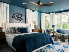 A star of HGTV Dream Home 2017, the grand master suite is a show-stopper with a chic navy bedroom, walk-in closet and spa-like bathroom.