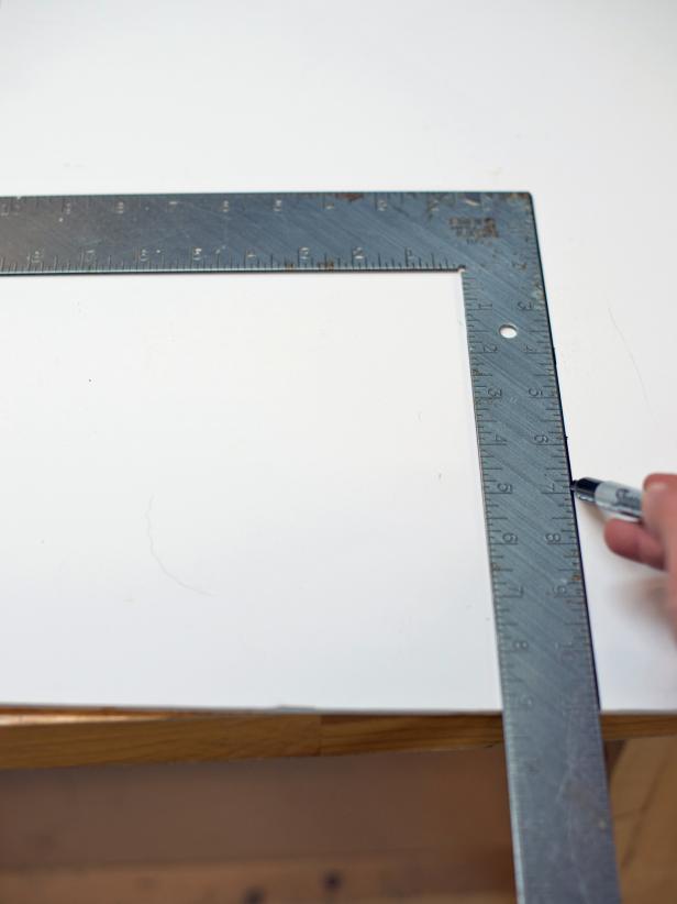 Use a carpenter’s square to measure out a template on white foam core board that is 12” square. Mark out square with permanent marker and cut on both lines with a utility knife. Tip: A larger square may be required if curtain rod hardware will be positioned wider and/or higher than the 12” square will allow. The 12” square should work in most cases, though.