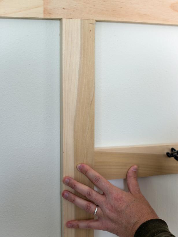 Cut 1” x 4” boards to 14” long to use as rails. Use 14” “measuring stick” to measure between top rail and lower rail to form a 14” square pattern. Once properly placed and level, nail into place with finishing nails to secure.