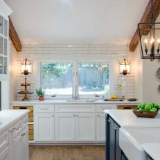 Open Concept Kitchen With White Cabinets and Subway Tile Backsplash