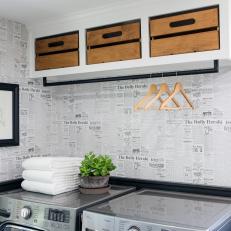 Renovated Laundry Room With Newspaper-Like Wallpaper